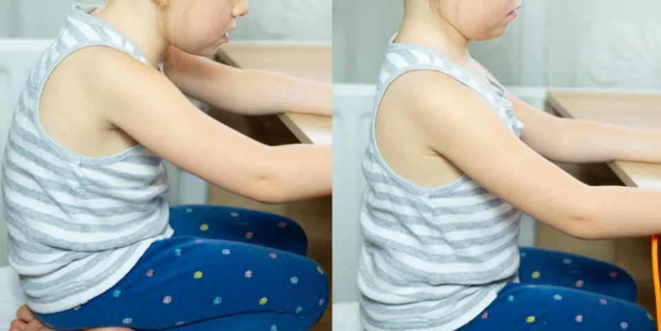 Posture and Alignment Child improving posture and ergonomics while sitting at desk